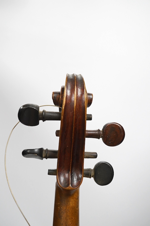 Two late 19th or early 20th century violins, one with case, back of largest measures 36cm. Condition - poor to fair